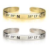Gold and silver cuff bracelets with engraved coordinates