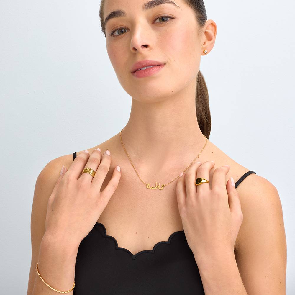 Arabic name necklace worn on model